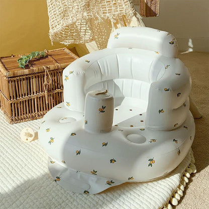 Inflatable baby chair for dining and bath with rainbow design, made by BackupMyFilesNow.com, suitable for infants.