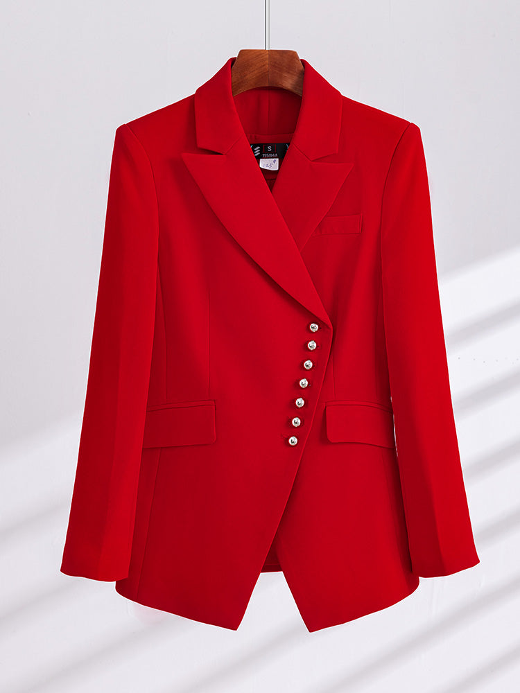 Red two-piece women's business suit with pants, stylish and professional, featuring a tailored blazer and matching trousers.