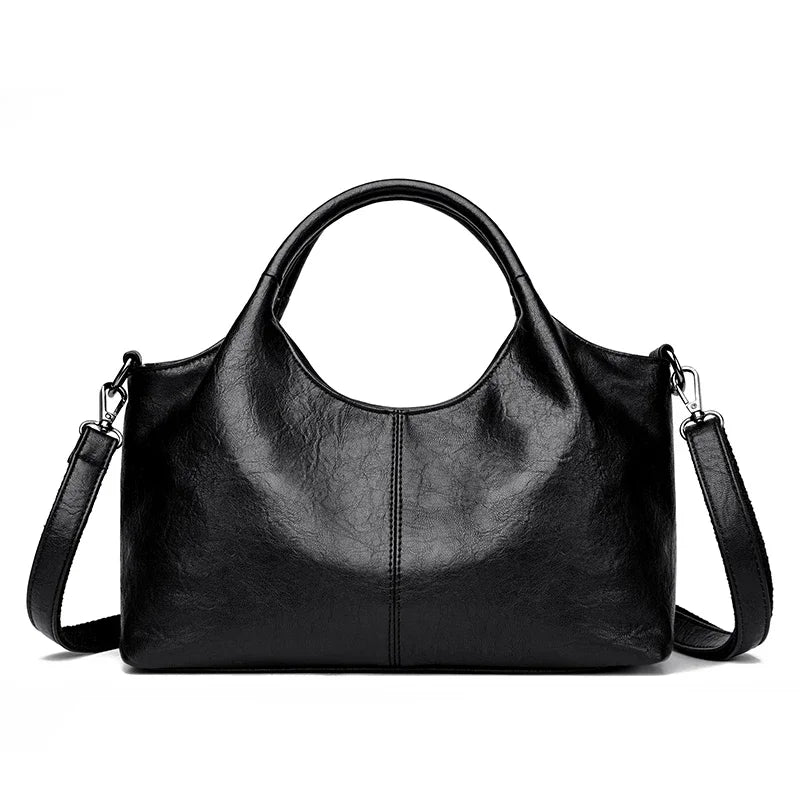Red leather tote bag for women with large capacity, soft designer leather, shoulder and crossbody style, stylish female handbag.
