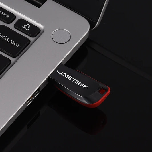 Red plastic pendrive flash drive with key ring, USB 2.0, available in 128MB to 32GB, compatible with car, TV, and computer.