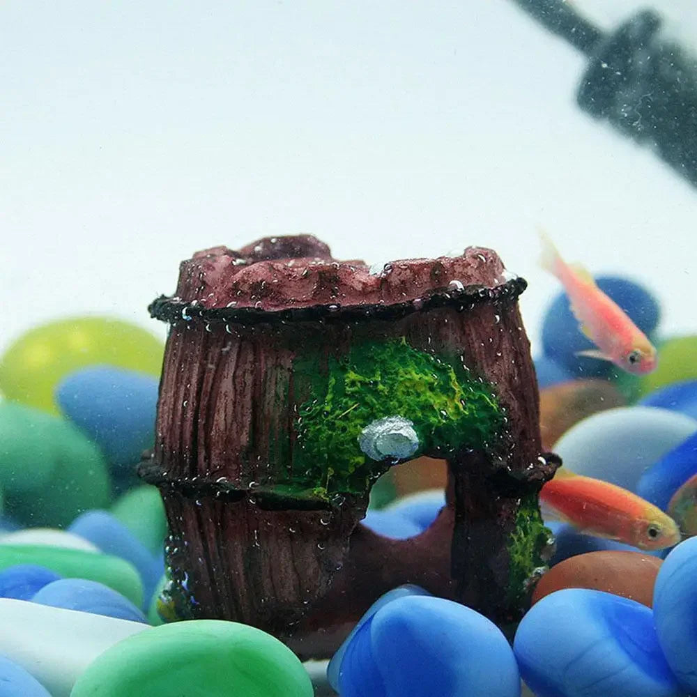 Red resin aquarium decoration with glass fish tank landscaping accessories, artificial antique-style decor for aquariums.