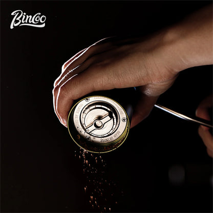 Bincoo portable manual coffee bean grinder with stainless steel burrs, CNC build, crank handle, ideal for baristas and home brewing.