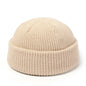 Red knitted beanie hat for men and women, warm wool cap with simple, solid design, perfect for autumn and winter fashion.