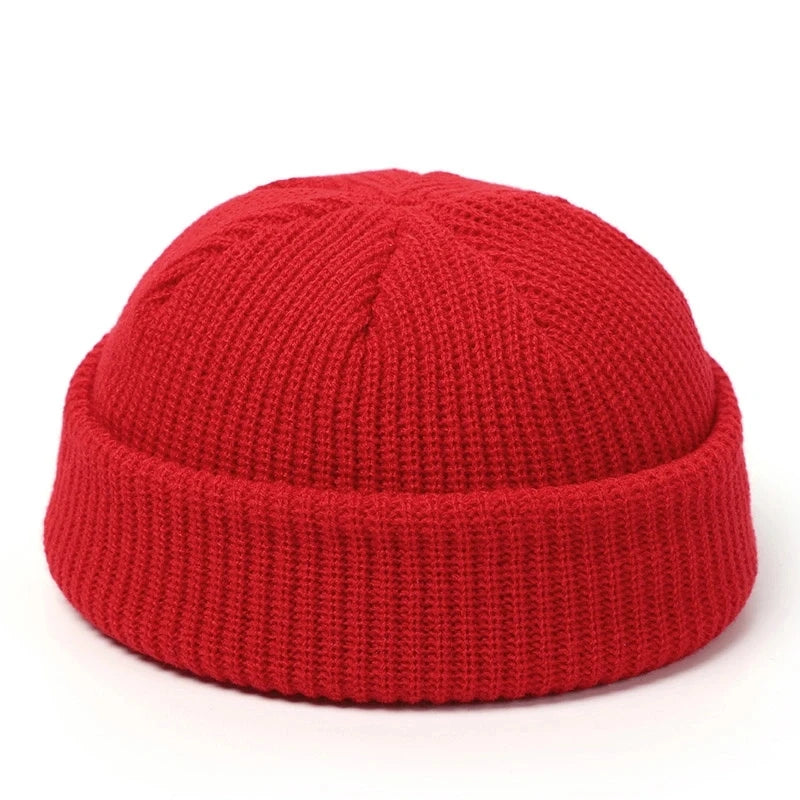 Red knitted beanie hat for men and women, wool fashion skullie cap, warm and simple winter style.