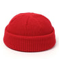 Red knitted beanie hat for men and women, wool fashion skullie cap, warm and simple winter style.