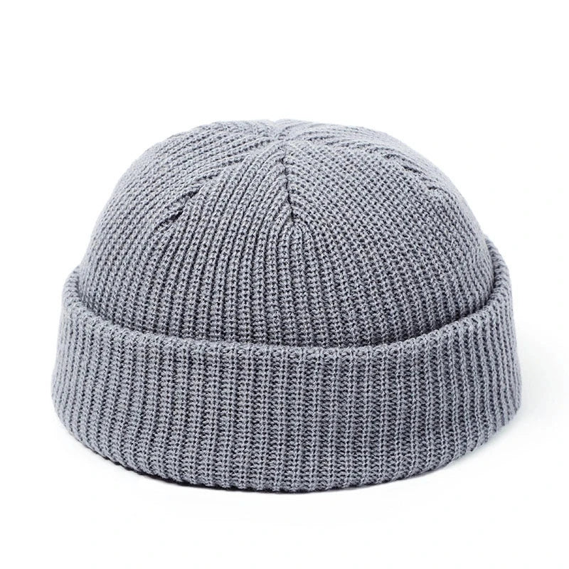 Red wool knitted beanie cap for men and women, warm, simple, and stylish skullies beanie for autumn and winter fashion.