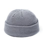 Red wool knitted beanie cap for men and women, warm, simple, and stylish skullies beanie for autumn and winter fashion.