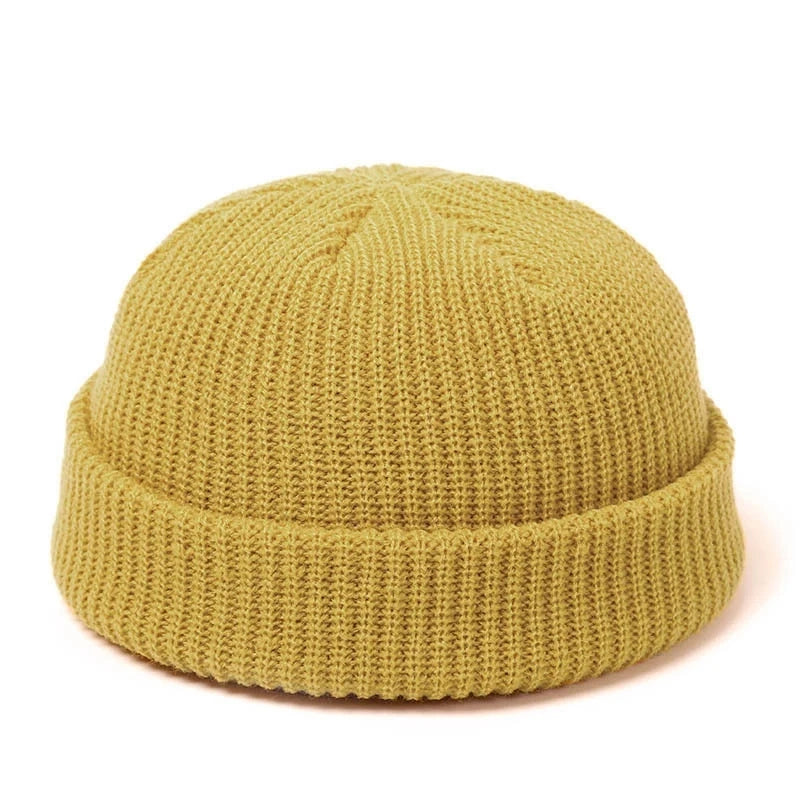 Red knitted beanie hat for men and women, warm wool cap with simple, solid design, perfect for autumn and winter fashion.
