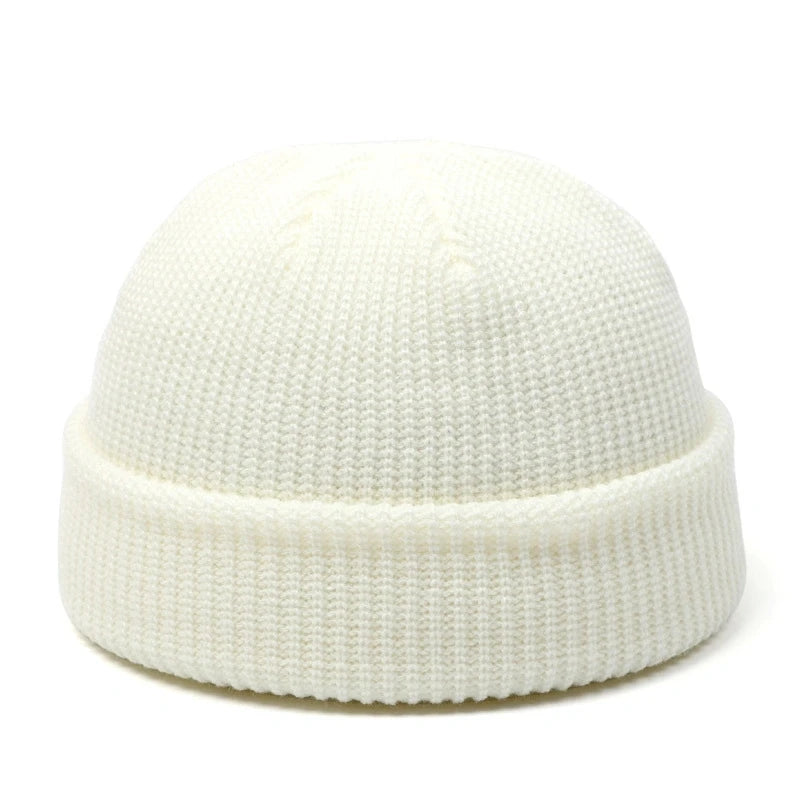 Red knitted wool hat for men and women, simple warm beanie cap with a trendy, solid design for autumn and winter.