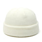 Red knitted wool hat for men and women, simple warm beanie cap with a trendy, solid design for autumn and winter.
