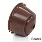 Red reusable coffee capsule filter for coffee machine, single piece, compatible with various espresso makers.