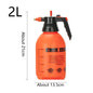 Red watering can for indoor plants, with a spray nozzle for watering flowers, garden, and houseplants.