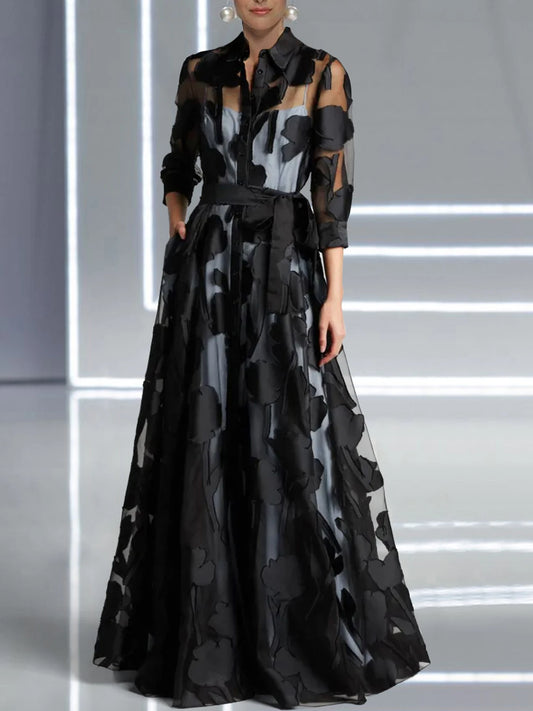 Elegant black three-quarter sleeve jacquard mesh maxi dress with knotted waist, transparent design, perfect for club or party wear.