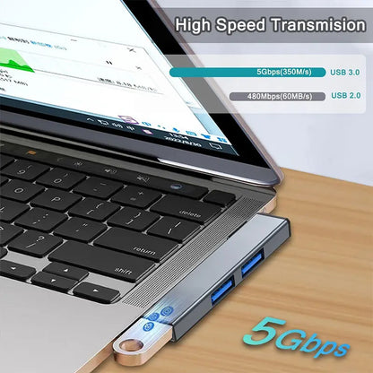 Aluminum 3-port USB hub with USB 2.0 and USB 3.0 ports for laptops and PCs, ideal for flash drives and external hard drives.