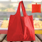 Set of four foldable reusable grocery bags from BackupMyFilesNow.com, machine washable shopping totes for eco-friendly shopping.