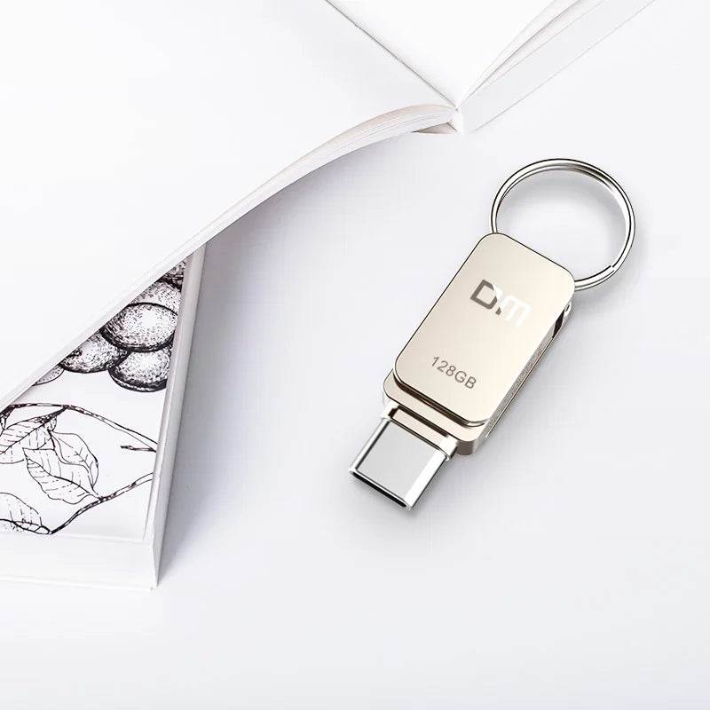 Silver BackupMyFilesNow 32GB USB-C OTG USB 3.0 flash drive with compact design for smartphones and data transfer.
