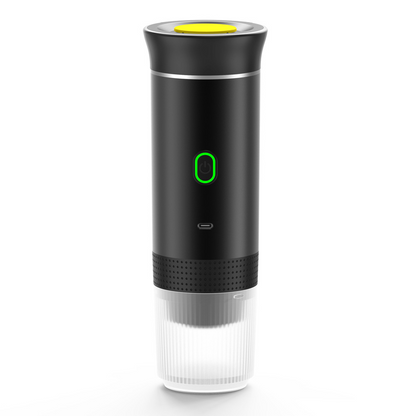 Silver portable coffee machine by BACKUPMYFILESNOW.COM® with compact design and brewing components visible.