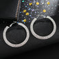 Luxury round crystal hoop earrings for women featuring sparkling crystal embellishments and a sleek, polished metal finish.