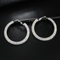 Luxury round crystal hoop earrings for women by BACKUPMYFILESNOW.COM®, featuring sparkling crystal embellishments and polished metal finish.