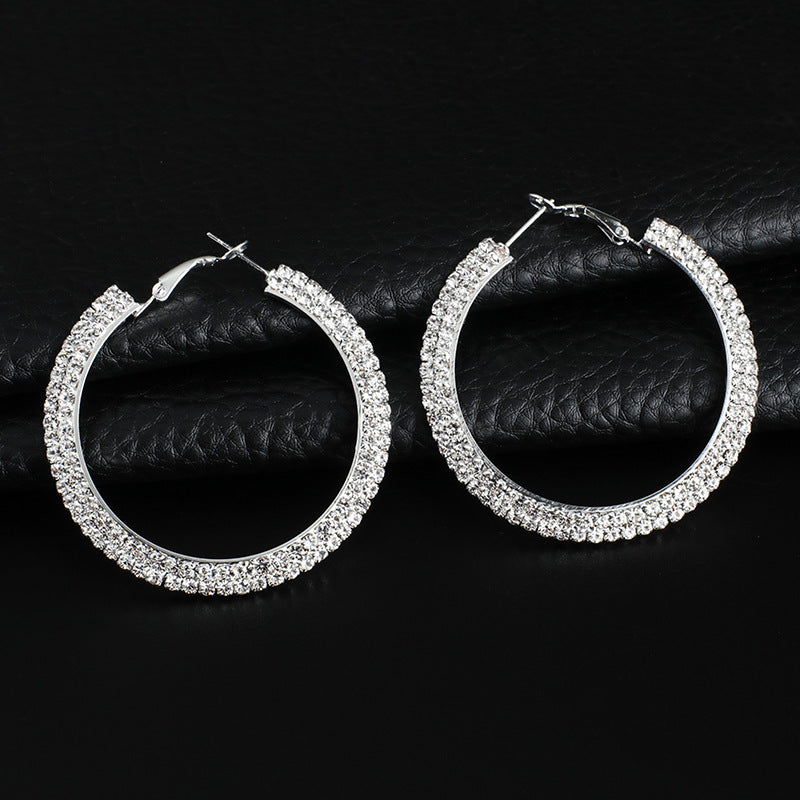 Luxury round crystal hoop earrings for women by BACKUPMYFILESNOW.COM® featuring sparkling crystal embellishments and polished metal finish.