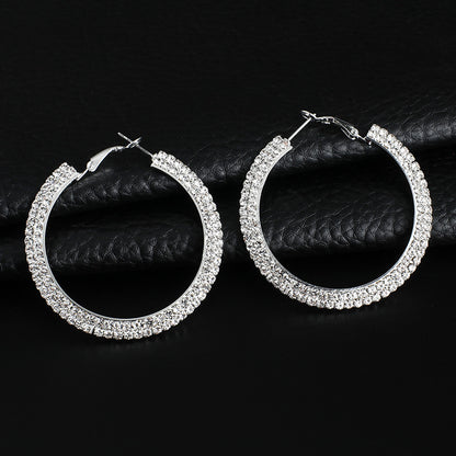 Luxury round crystal hoop earrings for women by BACKUPMYFILESNOW.COM® featuring sparkling crystal embellishments and polished metal finish.