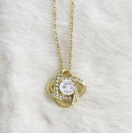 Four-leaf clover eternal love pendant from BACKUPMYFILESNOW.COM®, featuring a detailed silver charm with a four-leaf clover design.