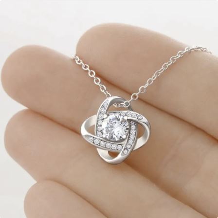 Four-leaf clover eternal love pendant by BACKUPMYFILESNOW.COM® featuring a silver heart-shaped charm with four-leaf clover design