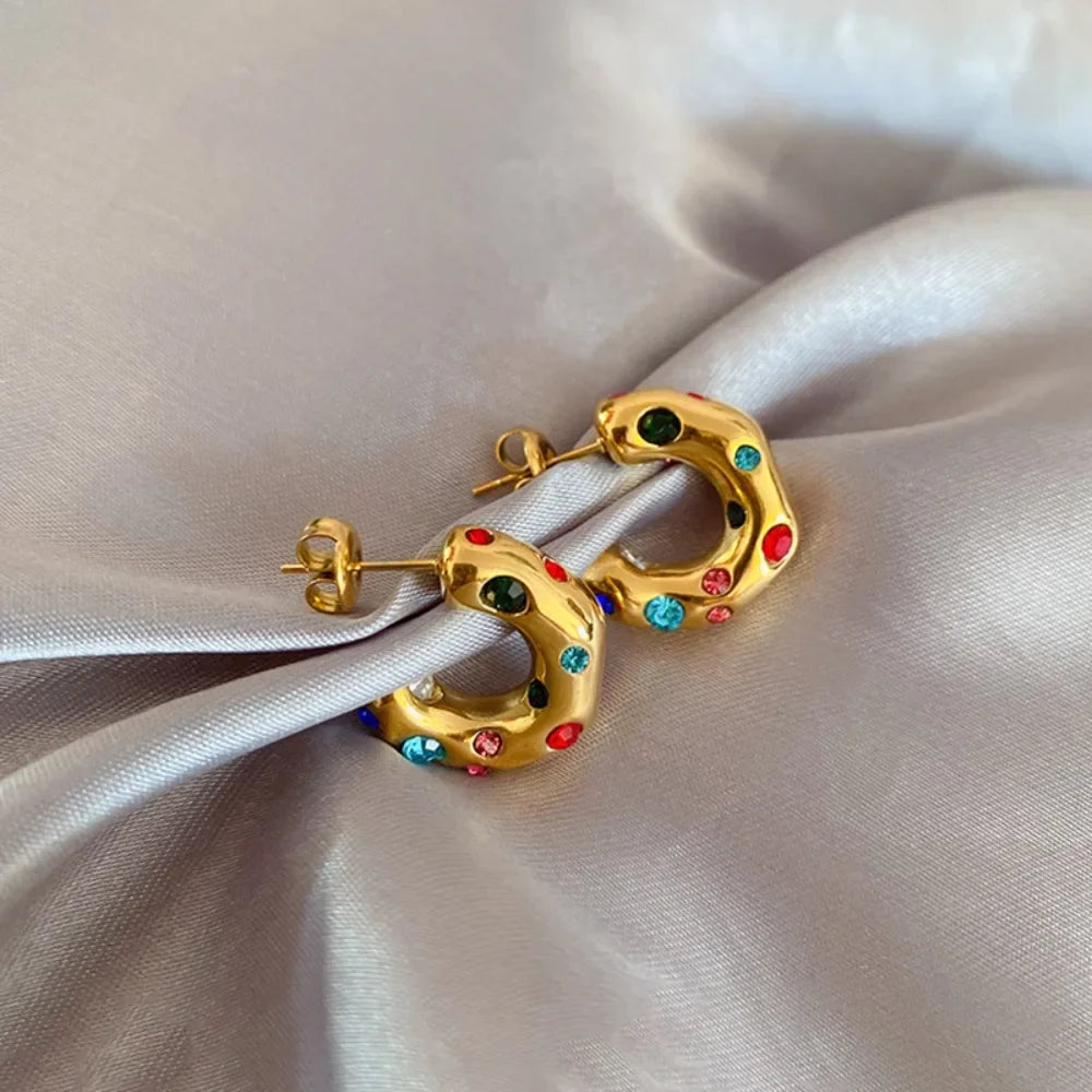 Gold plated chunky stainless steel earrings for women featuring irregular pearl, zircon accents, and a bold statement design.
