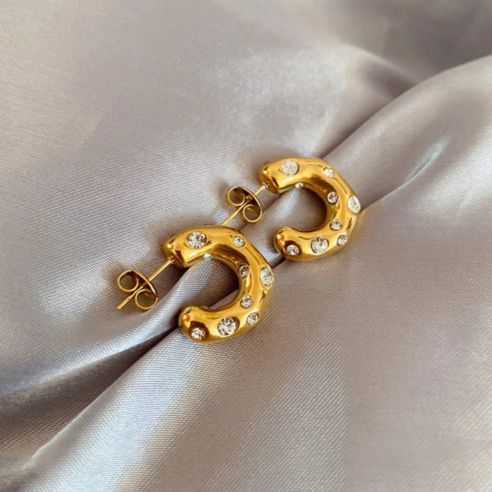 Gold plated stainless steel earrings for women with irregular pearls and zircon stones, featuring a chunky, statement design.