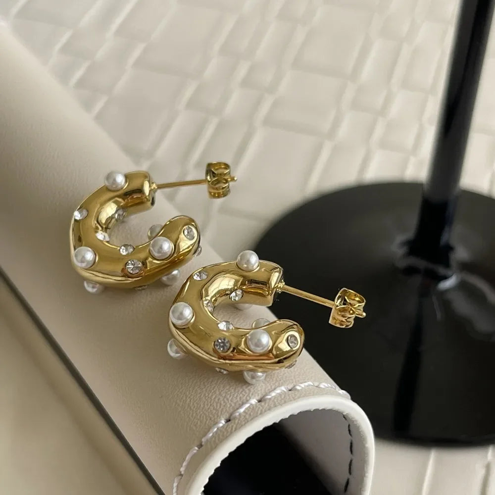 Gold plated stainless steel chunky earrings for women featuring irregular pearl and zircon accents, statement fashion jewelry.