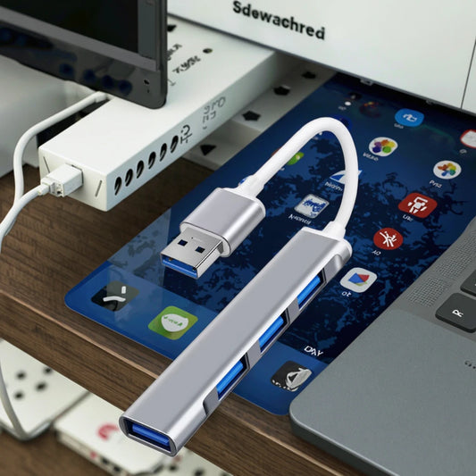 Silver New Trend 4-in-1 USB-C docking hub from BackupMyFilesNow.com with USB 3.0 ports for laptops and phones.