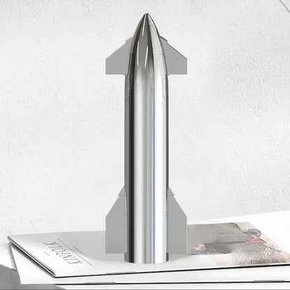 Silver SpaceX Starship rocket model by BACKUPMYFILESNOW.COM, featuring metallic texture, desktop display, with Dragon spacecraft and Falcon rocket.