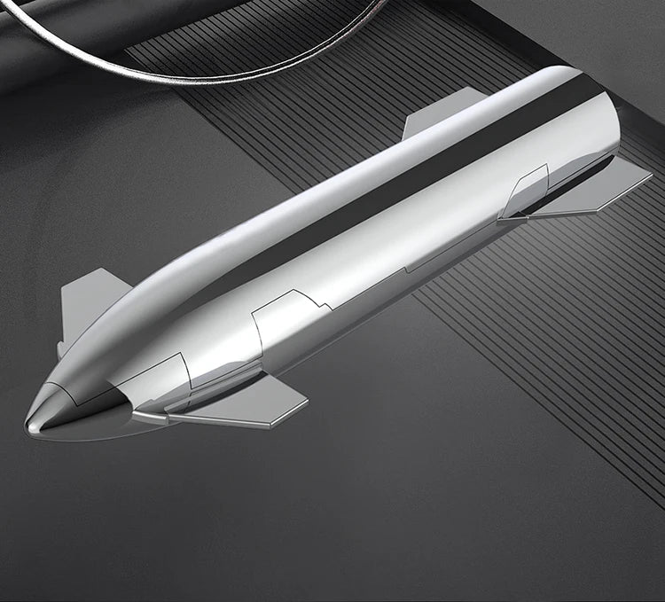 SpaceX Starship rocket model with metallic texture, NASA-themed desktop ornament, featuring Dragon spacecraft and Falcon rocket details.