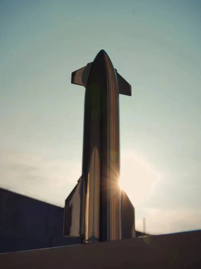 SpaceX Starship rocket model with metallic texture, NASA-inspired desktop ornament, featuring Dragon spacecraft and Falcon rocket design.