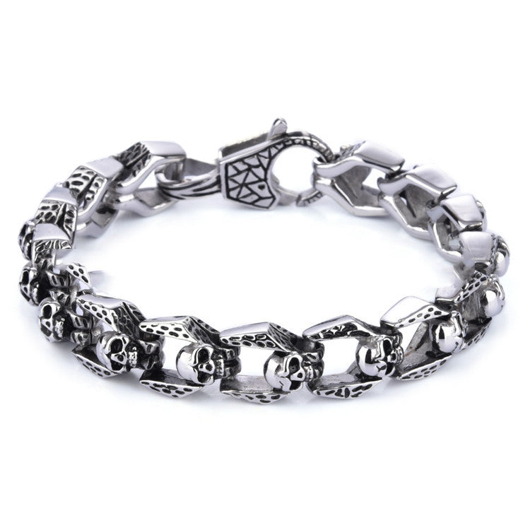 Stainless steel punk skull bracelet with edgy design, featuring skull motifs and bold metal links.