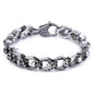 Stainless steel punk skull bracelet with edgy design, featuring skull motifs and bold metal links.
