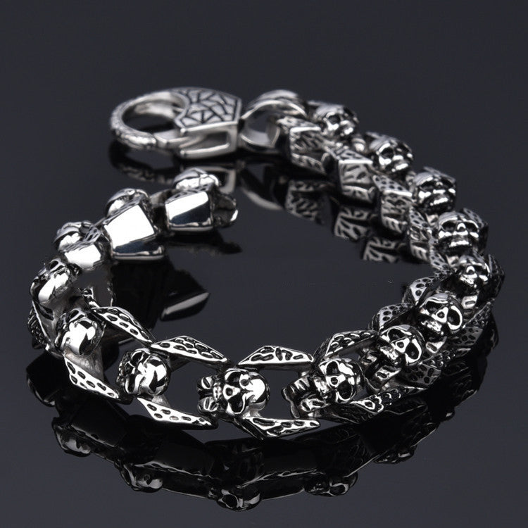 Stainless steel punk skull bracelet with bold skull design, featuring metal links for a rugged, edgy style.