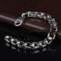 Stainless steel punk skull bracelet with edgy design, featuring detailed skull motifs and a bold, modern style.