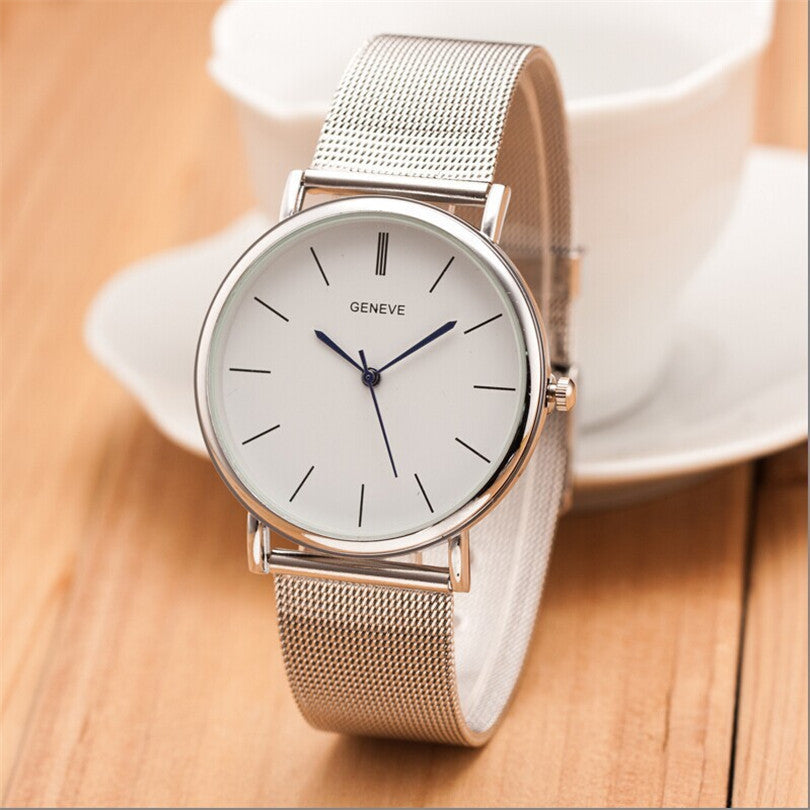 Silver quartz business watch with a sleek round dial and metal band, perfect for professional attire.