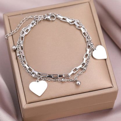 Couple's bracelet with double heart vintage design, featuring intricate metalwork and romantic style, ideal for couples' jewelry.
