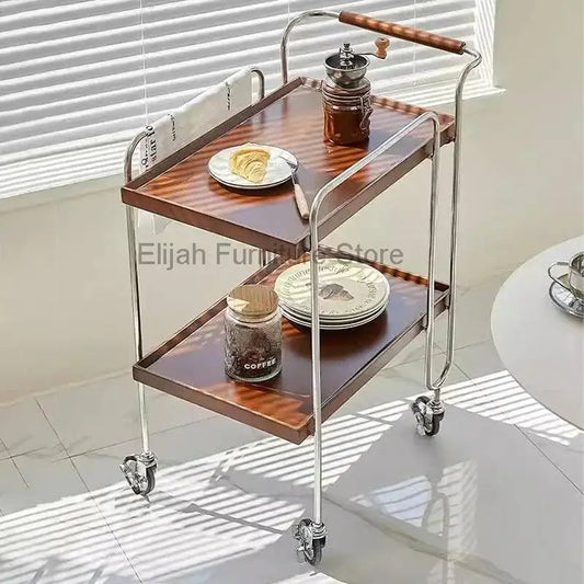 Medical salon trolley with rolling wheels, multiple shelves, and storage compartments for tools and tea service in a beauty workshop.