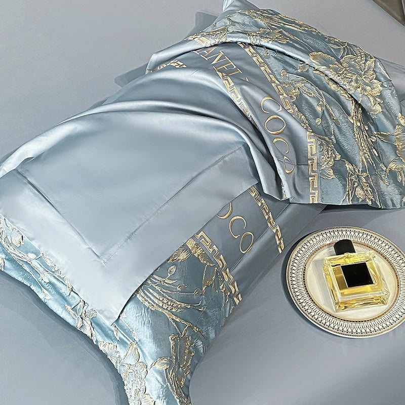 European luxury cotton bedding set with embroidered quilt cover, sheets, and hats, featuring high-end design and elegant craftsmanship.