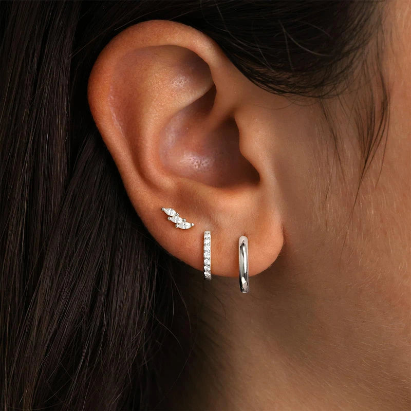 Set of three zircon-studded stainless steel huggie hoop earrings for women, perfect for cartilage piercing and everyday jewelry.