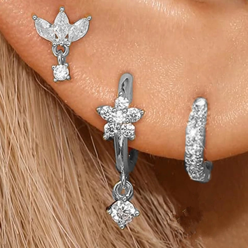 Set of three stainless steel zircon huggie hoop earrings for women, featuring small, elegant cartilage piercing jewelry.