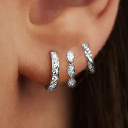 Set of three zircon hoop earrings for women, stainless steel cartilage earrings, stylish and delicate jewelry piercing accessory.
