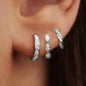 Set of three zircon hoop earrings for women, stainless steel cartilage earrings, stylish and delicate jewelry piercing accessory.