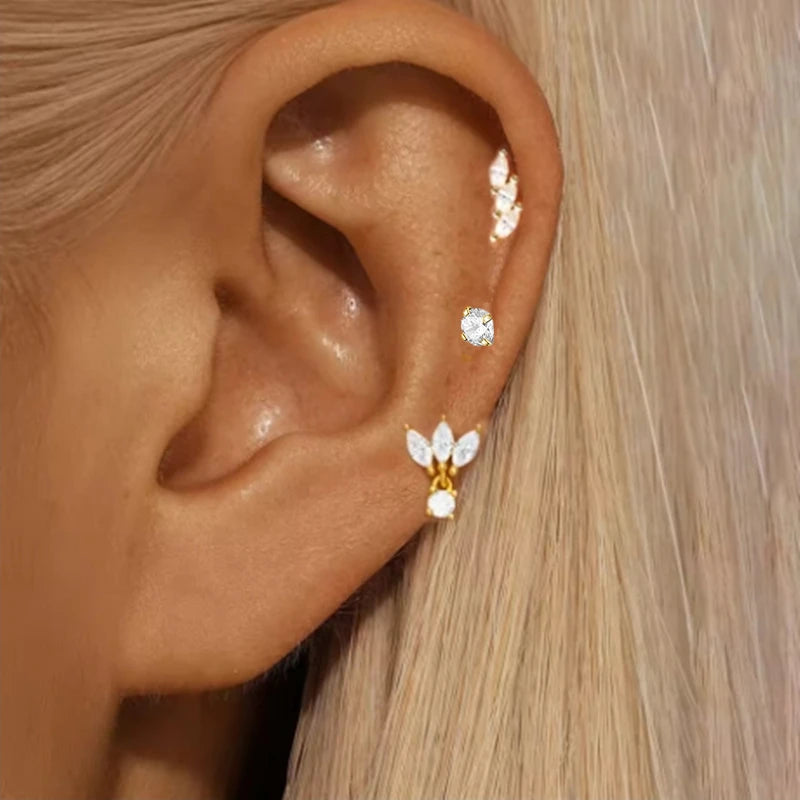 Set of three stainless steel zircon huggies hoop earrings for women, featuring delicate cartilage piercing jewelry.