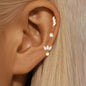 Set of three stainless steel zircon huggies hoop earrings for women, featuring delicate cartilage piercing jewelry.