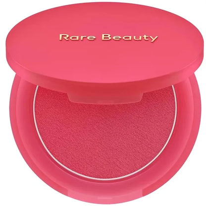 Rare Beauty Soft Pinch Matte Bouncy Cream-to-Powder Blush in airy, lightweight liquid form, natural makeup look on model's cheek.
