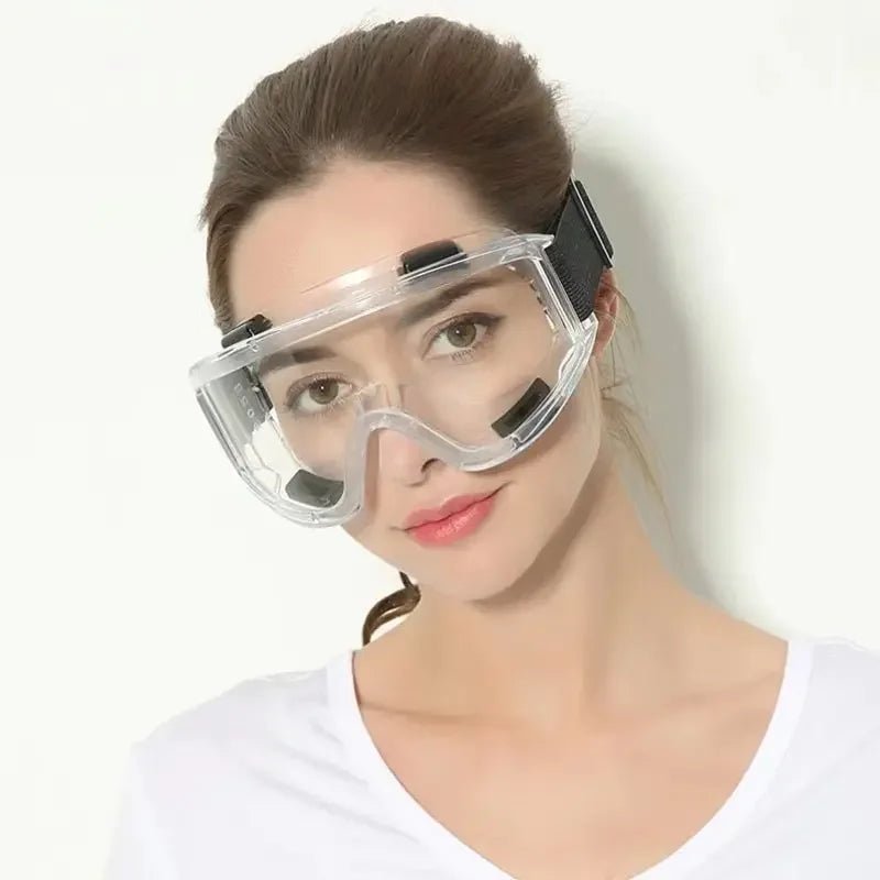 Clear safety goggles with anti-splash dust-proof lenses, providing eye protection for industrial lab work and research.